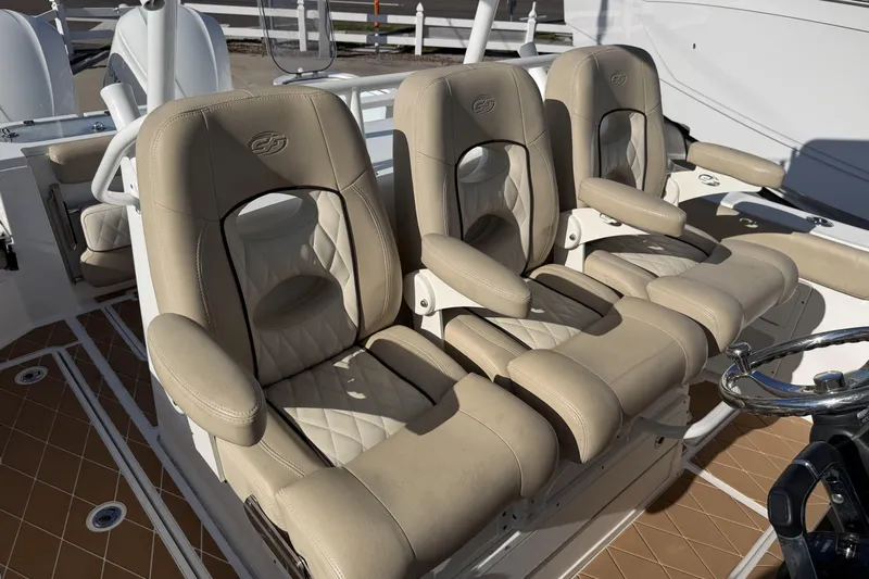  Yacht Photos Pics Luxurious seating on 2018 Sea Fox 328 Commander boat, featuring beige leather upholstery.