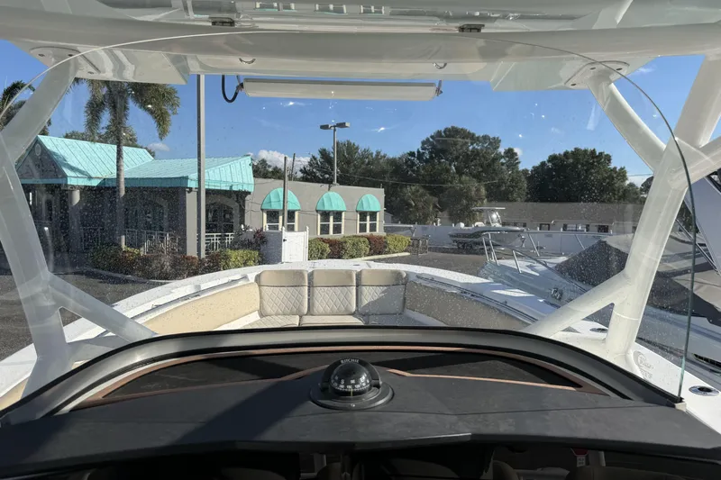  Yacht Photos Pics 2018 Sea Fox 328 Commander boat interior view with clear skies and marina backdrop.