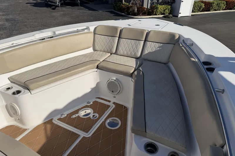  Yacht Photos Pics Luxurious seating area on a 2018 Sea Fox 328 Commander boat with tan cushions.