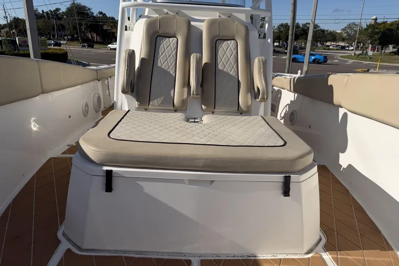  Yacht Photos Pics 2018 Sea Fox 328 Commander boat interior with cushioned seating and beige upholstery.