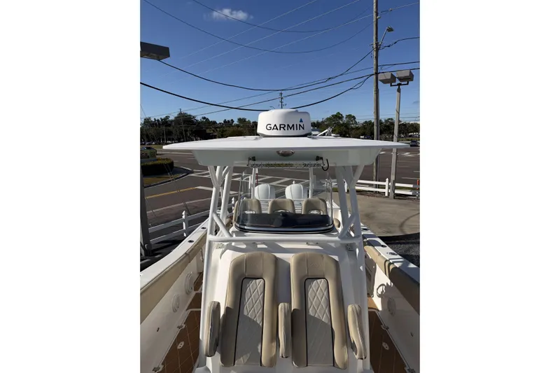  Yacht Photos Pics 2018 Sea Fox 328 Commander boat with Garmin equipment, featuring beige seating and a sleek design.
