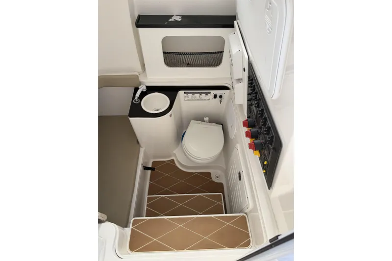  Yacht Photos Pics 2018 Sea Fox 328 Commander boat interior with toilet and control panel.