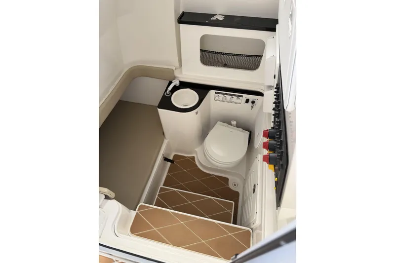  Yacht Photos Pics 2018 Sea Fox 328 Commander boat interior with toilet, sink, and seating area.