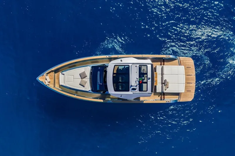 Nouveau Pardo 43 2026 Yacht Photos Pics Aerial view of 2026 Pardo Yachts P43 on vibrant blue ocean.