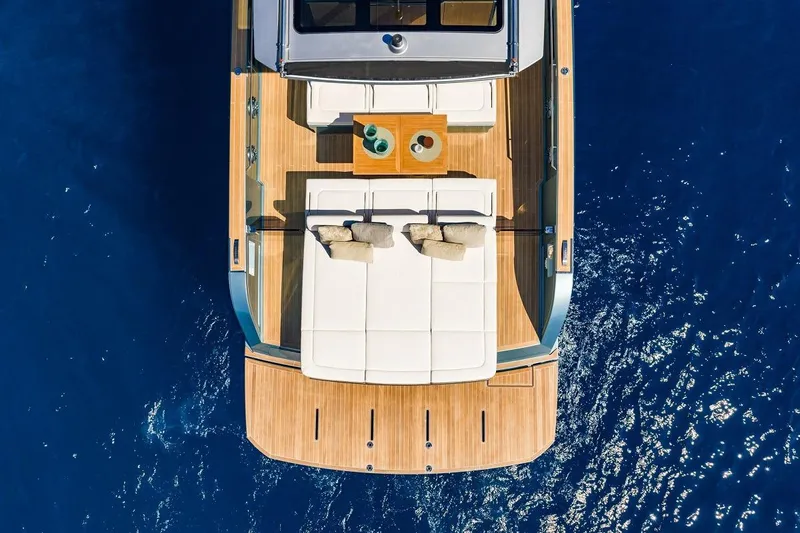 Nouveau Pardo 43 2026 Yacht Photos Pics Aerial view of 2026 Pardo Yachts P43 luxury deck on blue ocean.