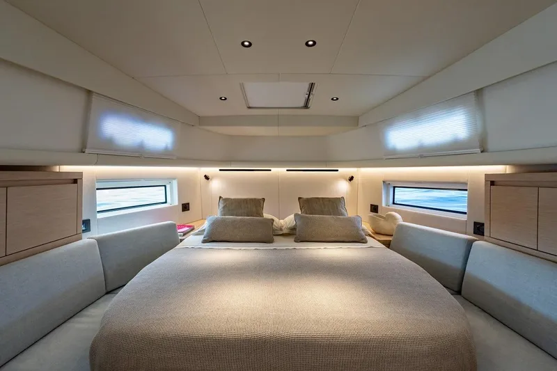 Nouveau Pardo 43 2026 Yacht Photos Pics Luxurious interior cabin of 2026 Pardo Yachts P43, featuring elegant bedding and modern design.