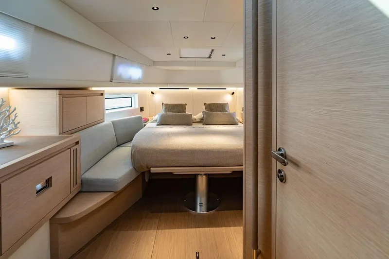Nouveau Pardo 43 2026 Yacht Photos Pics Luxurious cabin interior of 2026 Pardo Yachts P43, featuring modern design and cozy bedding.