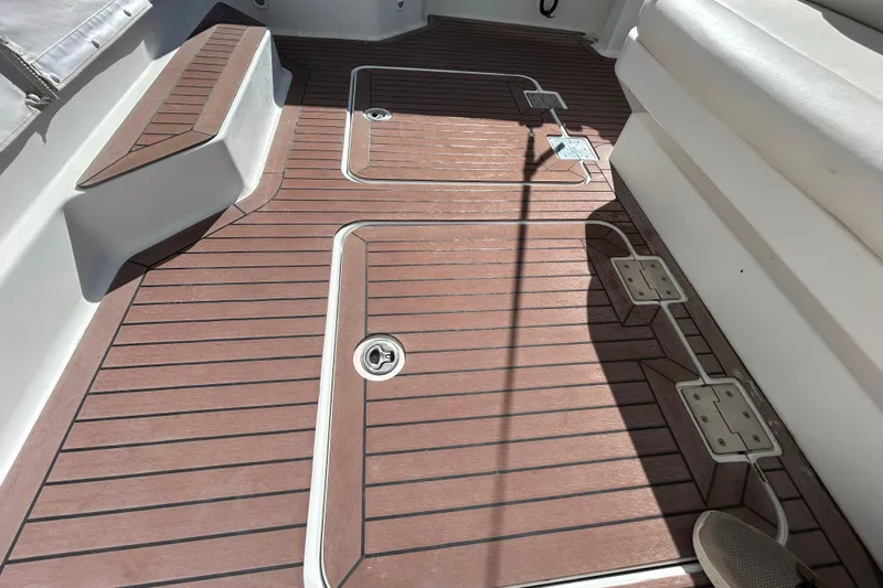 Solitude Yacht Photos Pics 2008 Back Cove 33 boat deck with wood finish and seating area.