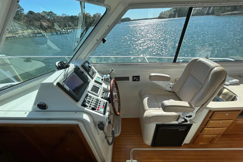 Solitude Yacht Photos Pics Helm of 2008 Back Cove 33 boat with leather seat and navigation controls.