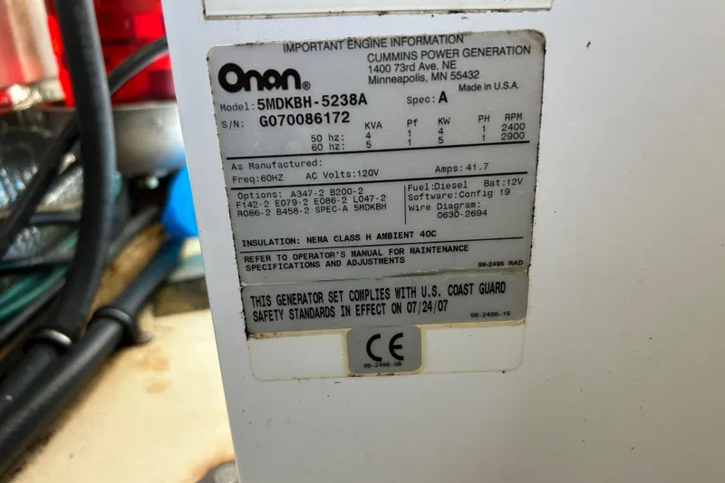 Solitude Yacht Photos Pics Onan generator label on 2008 Back Cove 33, detailing specifications and compliance standards.