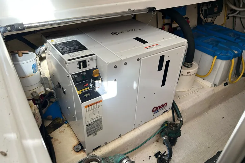 Solitude Yacht Photos Pics Engine room of 2008 Back Cove 33 with Onan generator and batteries.