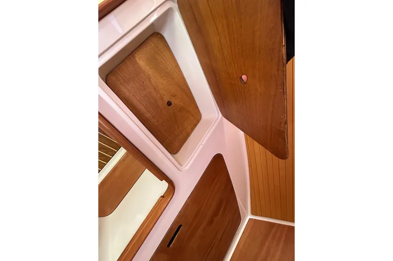 Solitude Yacht Photos Pics 2008 Back Cove 33 interior with wooden cabinetry and storage compartments.