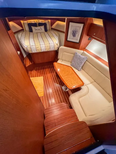  Yacht Photos Pics Luxurious 2006 Tiara Yachts 3200 Open cabin with cozy seating and elegant wood finishes.