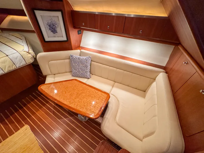  Yacht Photos Pics Luxurious interior of 2006 Tiara Yachts 3200 Open with elegant seating and wooden table.