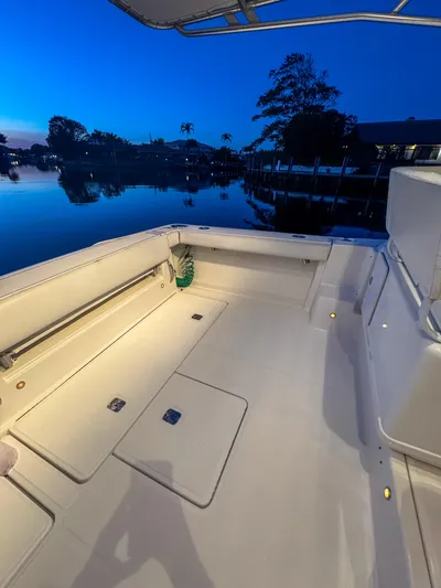  Yacht Photos Pics 2006 Tiara Yachts 3200 Open boat deck at dusk, reflecting serene waterfront views.