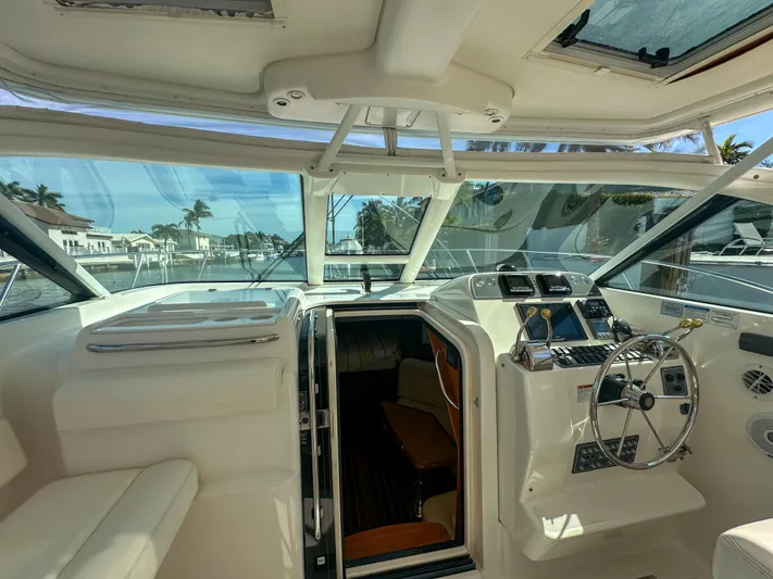  Yacht Photos Pics 2006 Tiara Yachts 3200 Open cockpit with steering wheel and navigation controls.