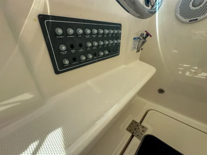  Yacht Photos Pics Control panel on 2006 Tiara Yachts 3200 Open, featuring multiple switches and speaker.