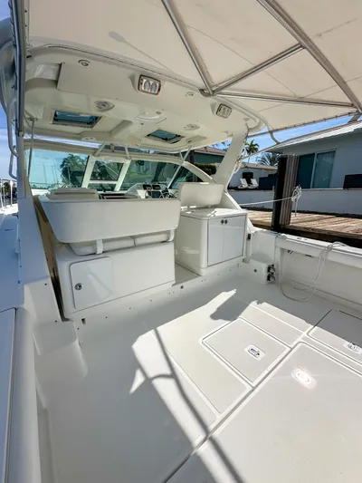  Yacht Photos Pics 2006 Tiara Yachts 3200 Open boat interior with seating and helm, showcasing luxury design.