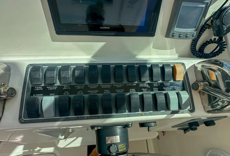  Yacht Photos Pics Control panel of a 2006 Tiara Yachts 3200 Open, featuring various switches and navigation equipment.