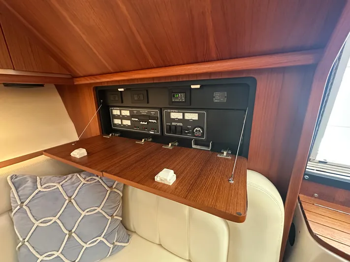  Yacht Photos Pics 2006 Tiara Yachts 3200 Open cabin with control panel and cushioned seating.