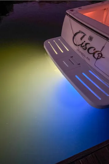  Yacht Photos Pics 2006 Tiara Yachts 3200 Open with underwater lights illuminating water.