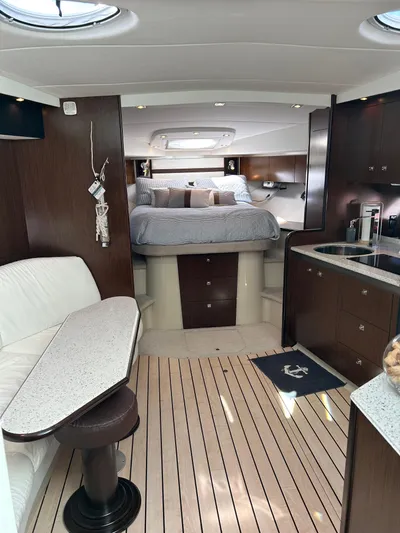  Yacht Photos Pics Luxurious interior of 2011 Cruisers Yachts 420 Sport Coupe with elegant wood finishes.