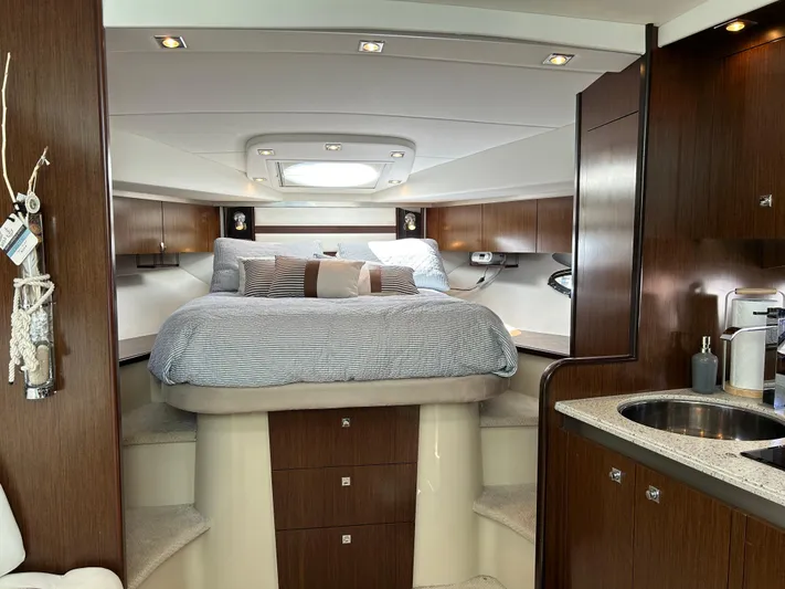  Yacht Photos Pics Luxurious interior of 2011 Cruisers Yachts 420 Sport Coupe with cozy bed and modern amenities.