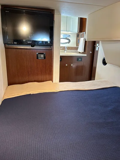  Yacht Photos Pics Interior of 2011 Cruisers Yachts 420 Sport Coupe with TV and cozy bedding.