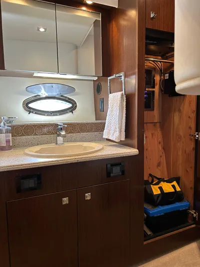  Yacht Photos Pics 2011 Cruisers Yachts 420 Sport Coupe bathroom with sink, mirror, and storage cabinet.
