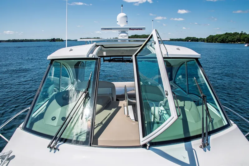  Yacht Photos Pics 2011 Cruisers Yachts 420 Sport Coupe on serene blue water, showcasing sleek design and open cockpit.