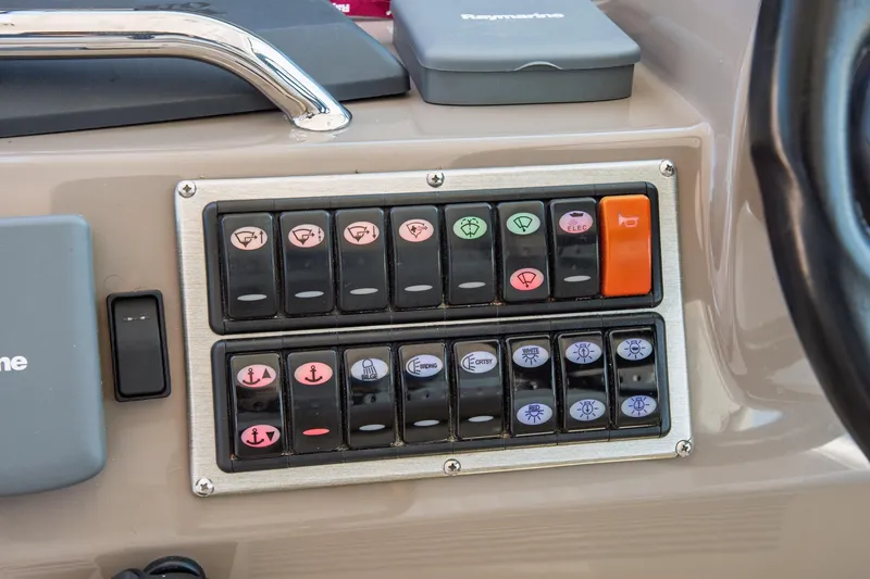  Yacht Photos Pics Control panel of a 2011 Cruisers Yachts 420 Sport Coupe with labeled switches.