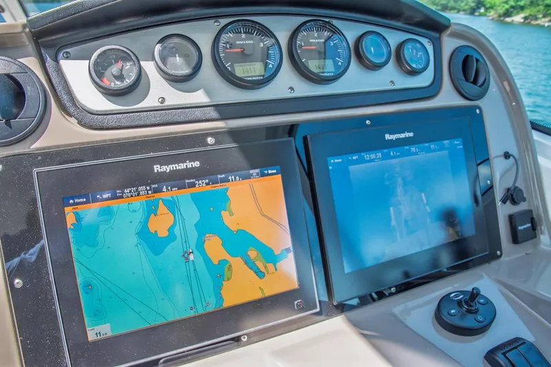  Yacht Photos Pics 2011 Cruisers Yachts 420 Sport Coupe dashboard with Raymarine navigation displays.
