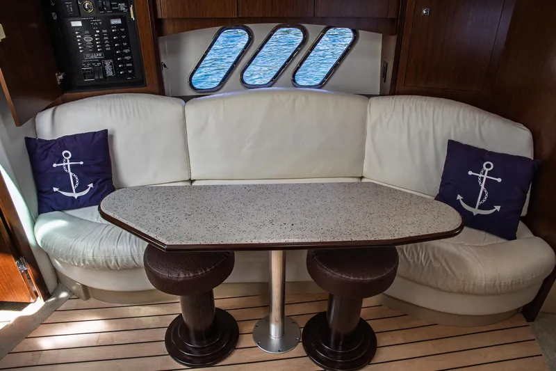  Yacht Photos Pics Interior of 2011 Cruisers Yachts 420 Sport Coupe with white seating and nautical decor.