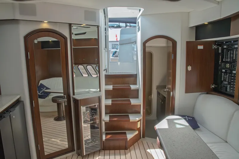  Yacht Photos Pics Interior of 2011 Cruisers Yachts 420 Sport Coupe, featuring elegant wood finishes and modern amenities.