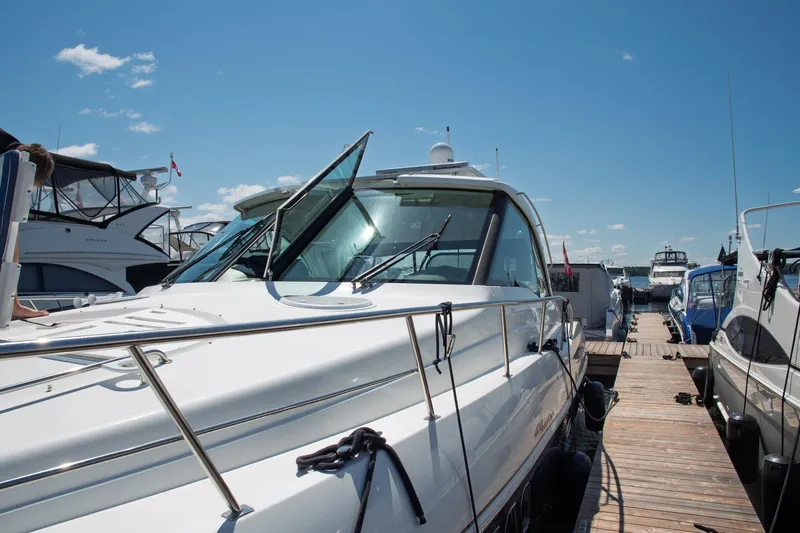  Yacht Photos Pics 2011 Cruisers Yachts 420 Sport Coupe docked under a clear blue sky.