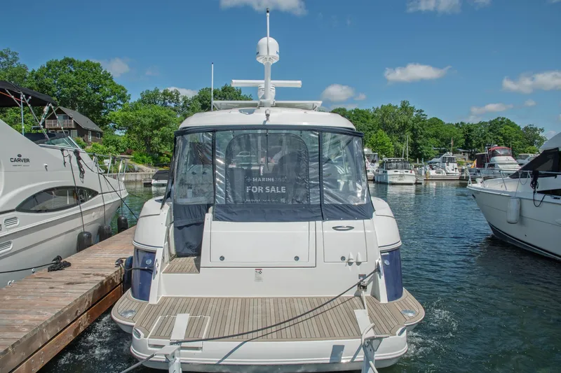  Yacht Photos Pics 2011 Cruisers Yachts 420 Sport Coupe docked, for sale, in a marina setting.