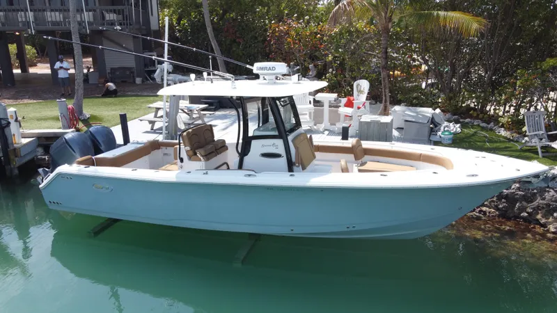  Yacht Photos Pics 2020 Sea Hunt Gamefish 30 Forward Seating boat docked in clear water.
