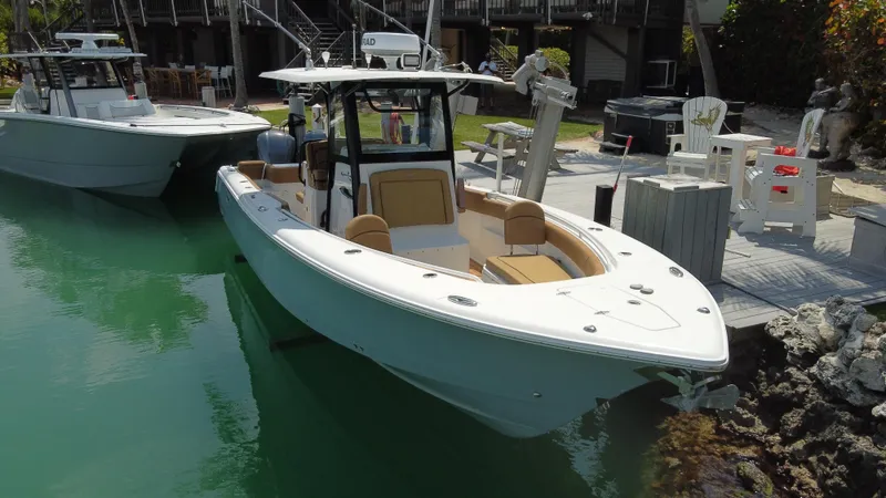  Yacht Photos Pics 2020 Sea Hunt Gamefish 30 Forward Seating boat docked in a marina.