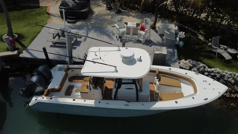  Yacht Photos Pics 2020 Sea Hunt Gamefish 30 boat docked, aerial view, featuring forward seating and dual engines.