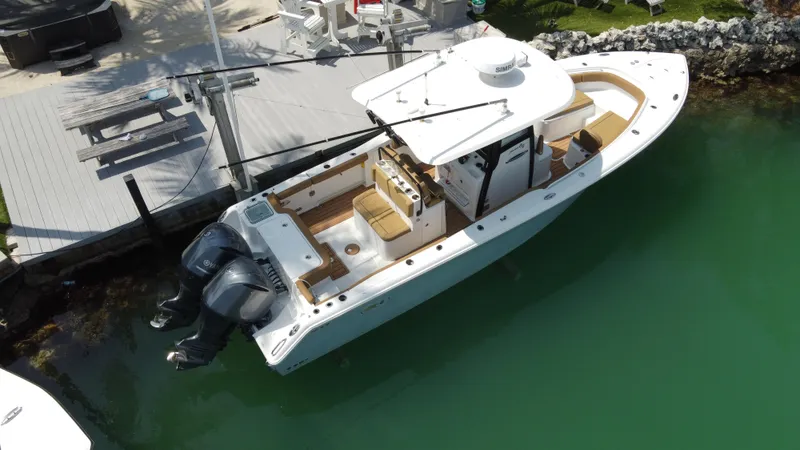  Yacht Photos Pics 2020 Sea Hunt Gamefish 30 Forward Seating boat docked in clear water.