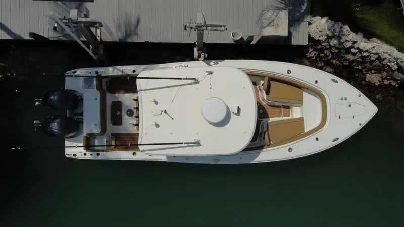  Yacht Photos Pics Aerial view of 2020 Sea Hunt Gamefish 30 boat docked, featuring forward seating and twin engines.