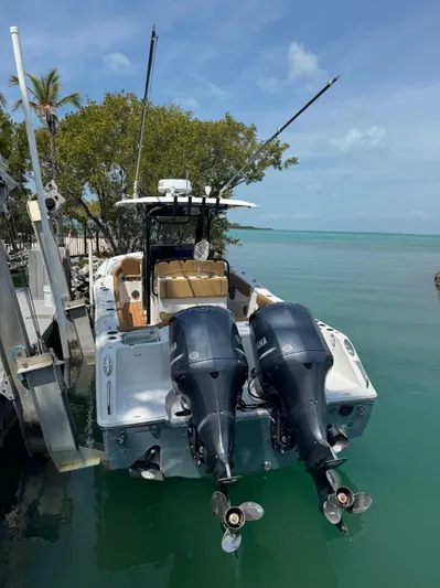  Yacht Photos Pics 2020 Sea Hunt Gamefish 30 boat with dual engines docked by turquoise water.