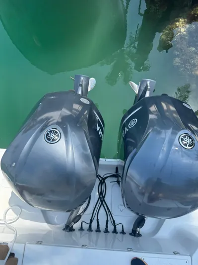  Yacht Photos Pics 2020 Sea Hunt Gamefish 30 with dual Yamaha outboard motors in clear water.