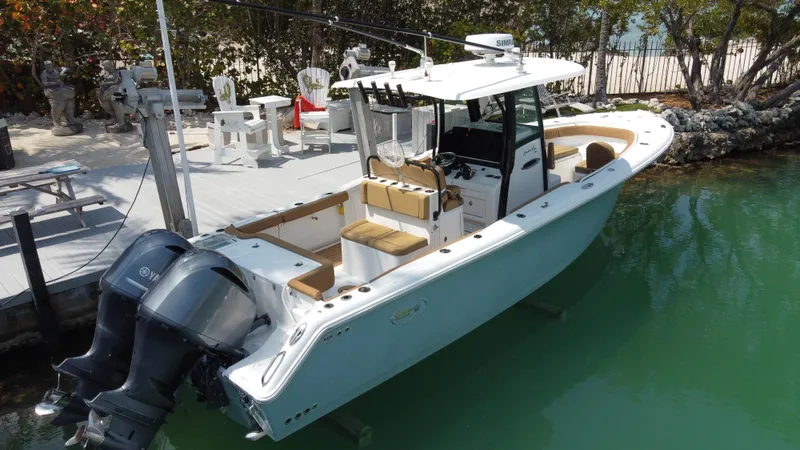  Yacht Photos Pics 2020 Sea Hunt Gamefish 30 boat docked, featuring forward seating and dual outboard motors.