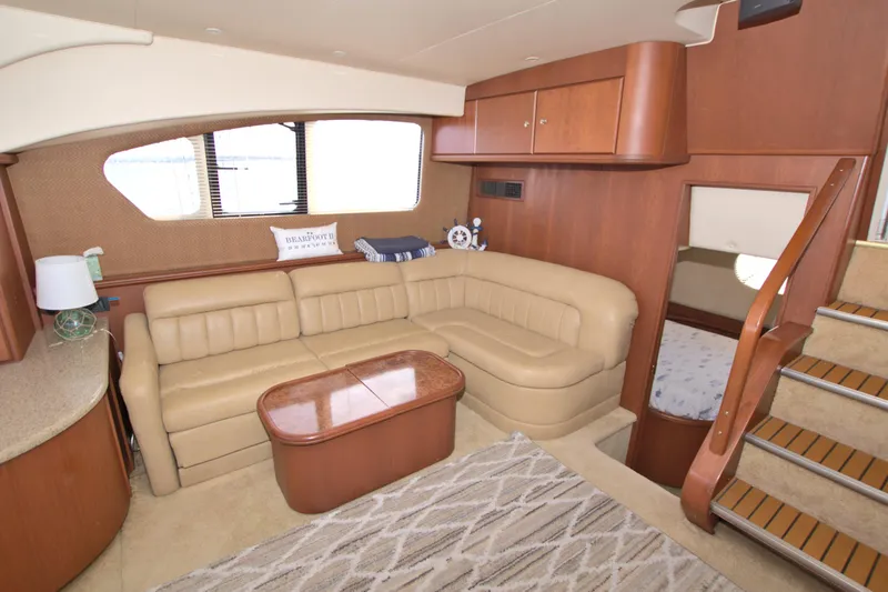 Bear Foot II Yacht Photos Pics 2006 Silverton 39 Motor Yacht interior with beige leather seating and wooden accents.