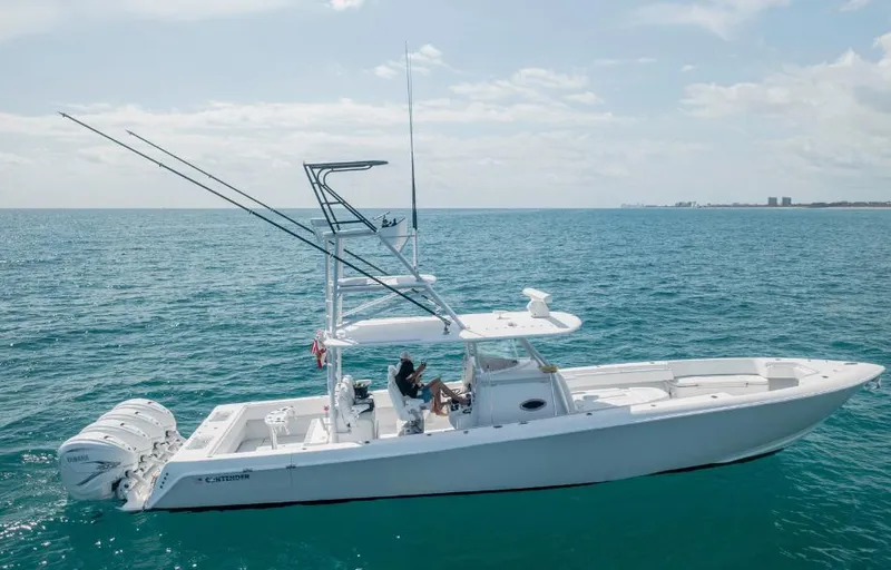 Yacht Photos Pics 2020 Contender 44 ST boat cruising on open ocean under clear sky.
