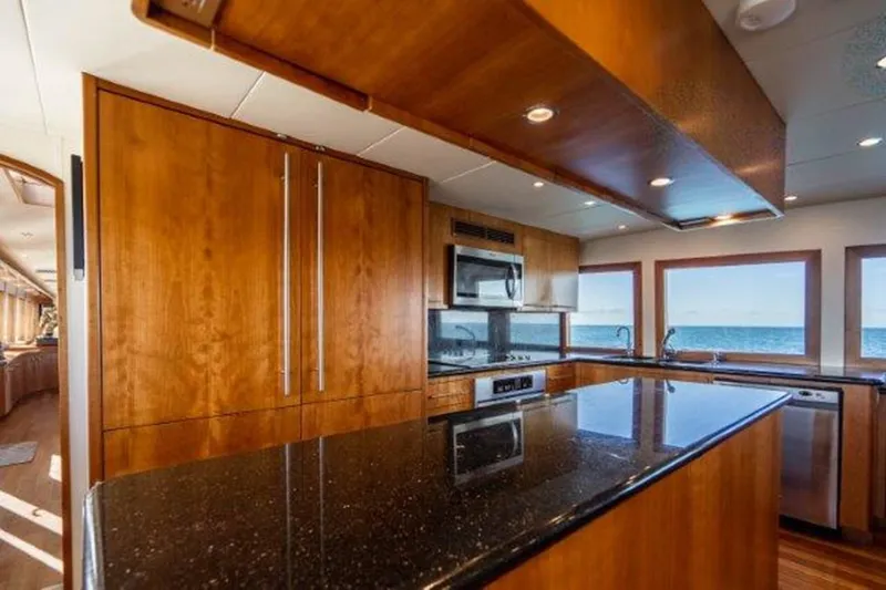 Claire Yacht Photos Pics Luxurious kitchen interior on 2003 Hatteras 100 yacht with ocean view.