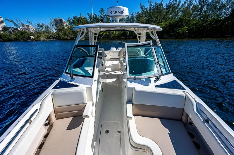  Yacht Photos Pics 2018 Boston Whaler 320 Vantage boat on water, featuring spacious seating and Garmin navigation.