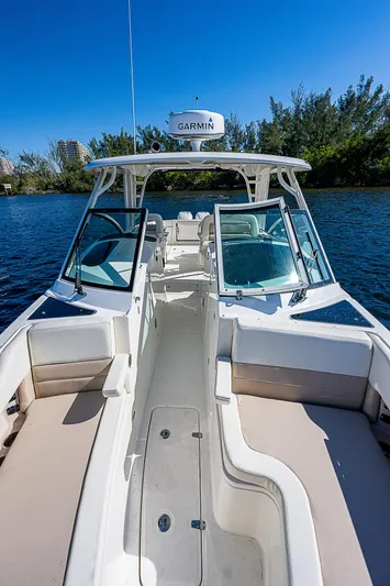  Yacht Photos Pics 2018 Boston Whaler 320 Vantage boat on water with open deck and seating.