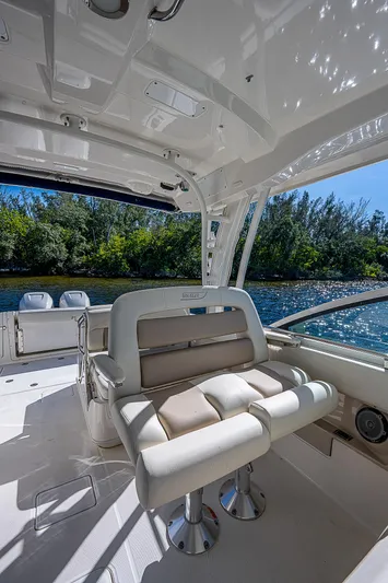  Yacht Photos Pics 2018 Boston Whaler 320 Vantage boat interior with seating and water view.